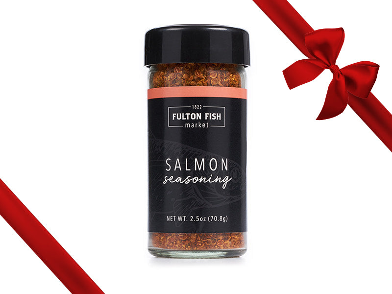 Fulton Fish Market Salmon Seasoning Bottle on White Background with Gift Bow Graphic on Top Right