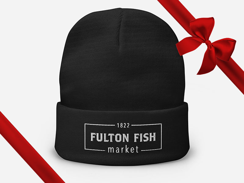 Black Beanie with Fulton Fish Market Logo on Front with Gift Bow Graphic on Top Right
