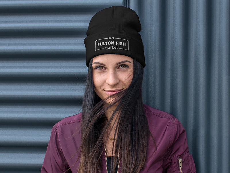 Black Beanie with Fulton Fish Market Logo on woman