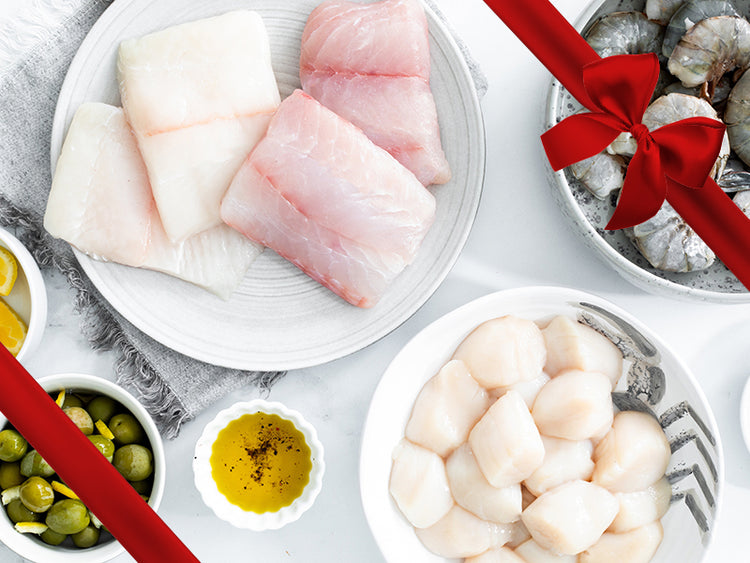 Sea Scallops, Wild Blue Shrimp, and Fish Portions on Plates with Gift Bow Graphic on Top Right