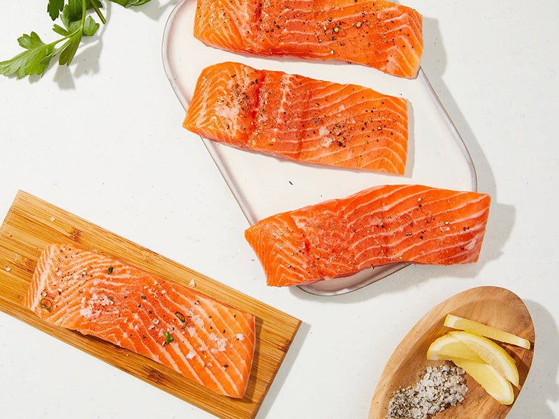 Steelhead Trout Portions with Salt and Pepper with Lemon Wedges and Parsley