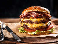 Cooked Pat LaFrieda Dry Aged Hamburger with Cheese, Lettuce, and Tomatoes