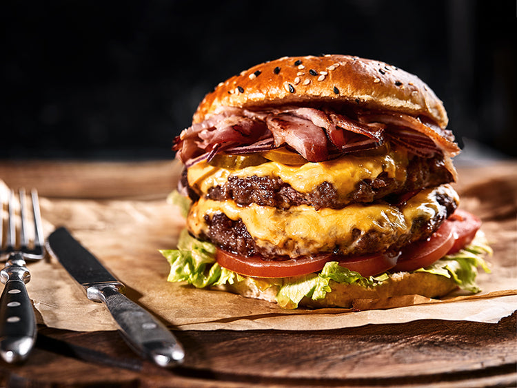 Cooked Pat LaFrieda Dry Aged Hamburger with Cheese, Lettuce, and Tomatoes