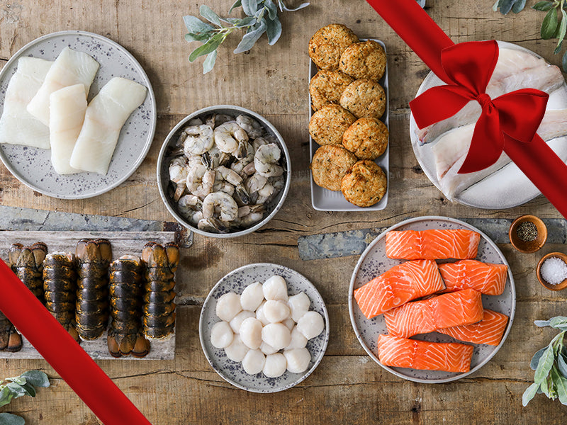 Branzino Fillets, Crab Cakes, Shrimp, Atlantic Halibut, Atlantic Salmon, Scallops and Lobster Tails on Plates with Gift Ribbon