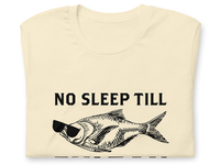 Front of folded Beige "No Sleep Till Fulton" T-Shirt with a fish with sunglasses