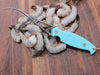 Toadfish Frogmore Shrimp Cleaner on Wooden Surface with Shrimp