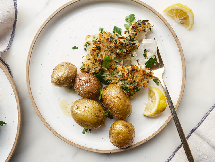 Panko Crusted Baked Cod with a Classic Herb & Dijon Marinade with potatoes and lemon