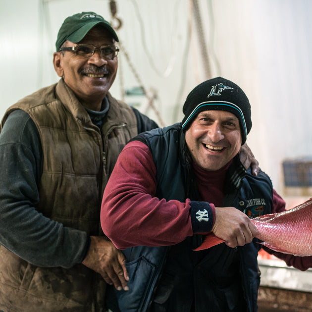 Two Fulton Fish Market Vendors Holding Whole American Red Snapper