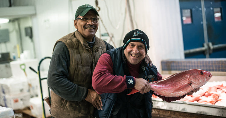 Two Fulton Fish Market Vendors Holding Whole American Red Snapper