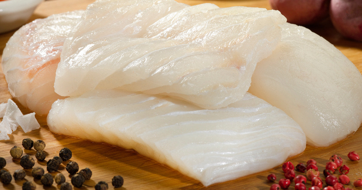 Halibut Portions on Wooden Surface with Peppercorns