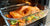 Cooked Salmon in Glass Pan with Veggies Coming Out of the Oven