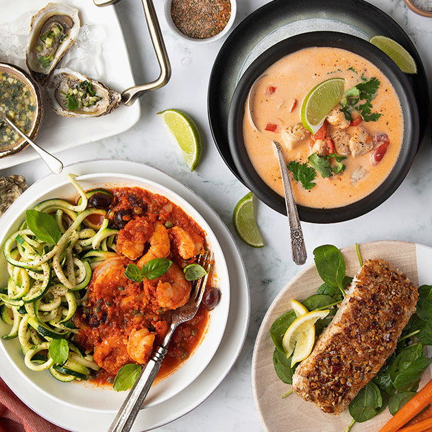 Assortment of Cooked Seafood on White Table