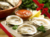 Shucked Blue Point Oysters with Sauce, Lemon Wedges and Parsley with Gift Bow Graphic on Top Right