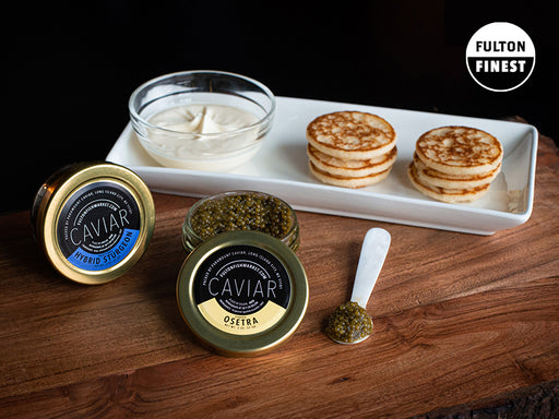 Fulton's Finest Imported Caviar in Jars on Wood Block with Creme Fraiche and Blinis