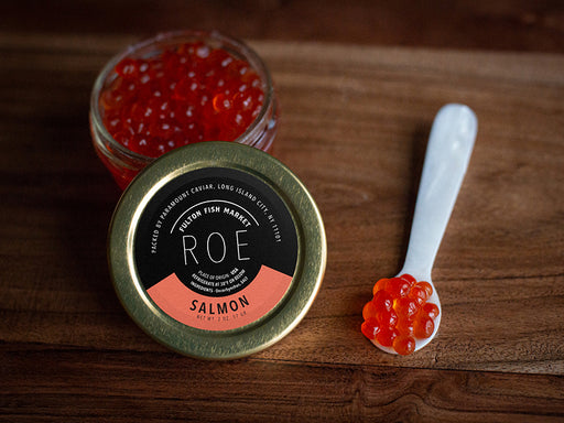 Salmon Roe in Jar with Spoon on Wood Surface