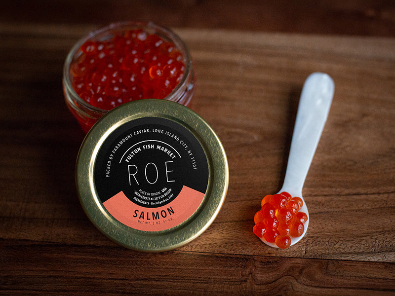 Salmon Roe in Jar with Spoon on Wood Surface