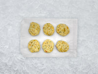 Fulton Fish Market Scampi Finishing Butter - 6ct pucks on white paper with ice background