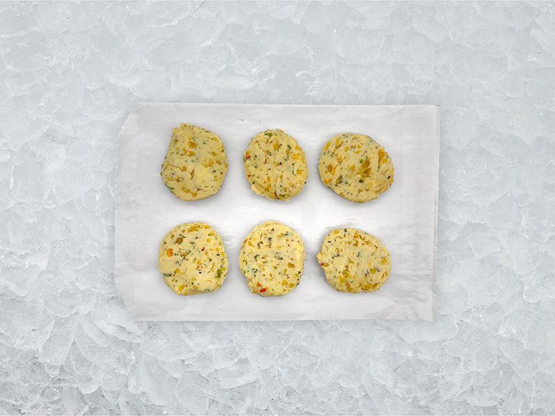 Fulton Fish Market Scampi Finishing Butter - 6ct pucks on white paper with ice background