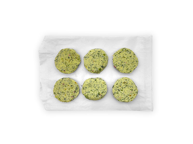 Fulton Fish Market Garlic & Herb Finishing Butter - 6ct pucks on white paper with white background