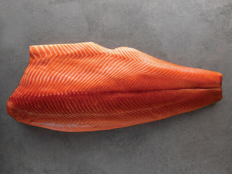 Ora King Salmon Fillet on Grey Surface