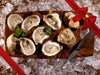 Shucked Pemaquid Oysters with Lemon Wedges, Herbs, and Oyster Knife with Gift Bow Graphic on Top Right