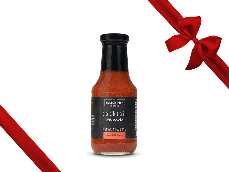 Fulton Fish Market Cocktail Sauce Bottle on White Background with Gift Bow Graphic on Top Right