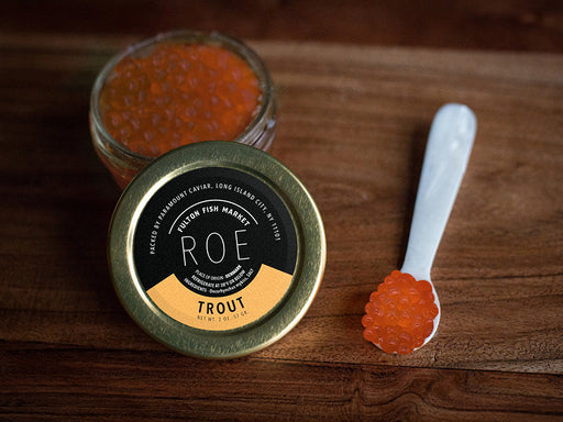 Trout Roe Jar Opened with Mother of Pearl Spoon on Wooden Surface