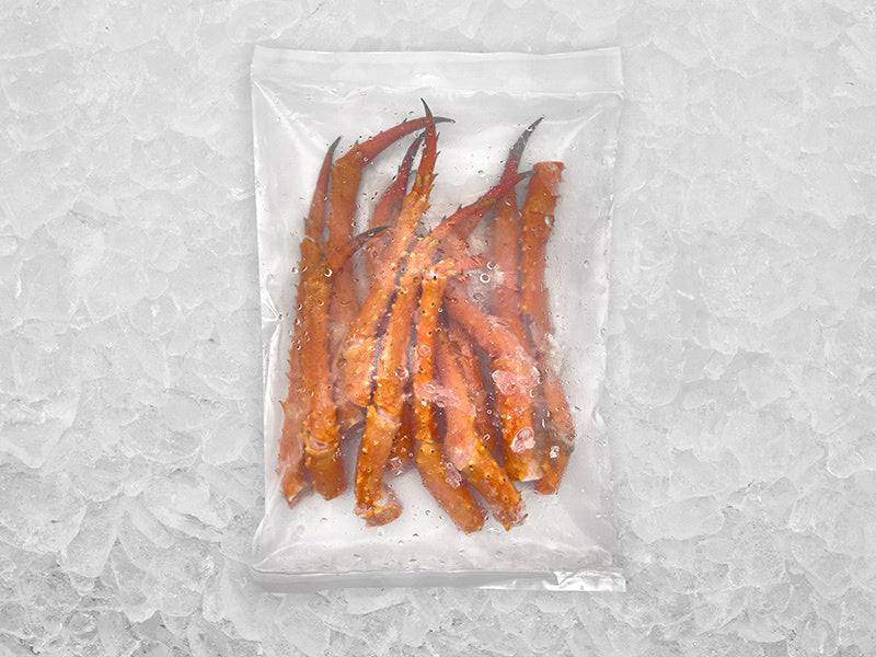 Wild Golden King Crab lower legs in package on ice