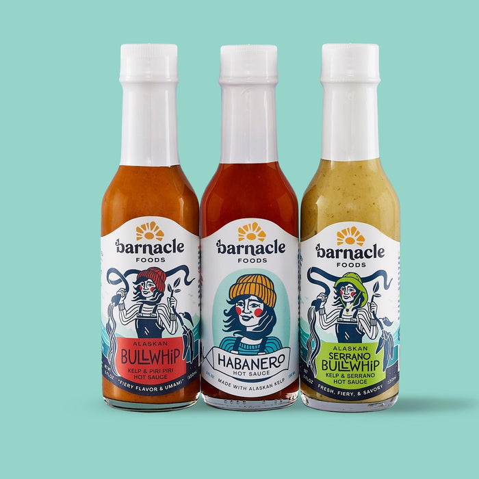Barnacle Foods Hot Sauce Bottles on Teal Background