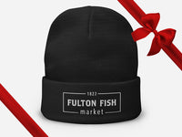 Black Beanie with Fulton Fish Market Logo on Front with Gift Bow Graphic on Top Right