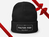 Black Beanie with Fulton Fish Market Logo on Front with Gift Bow Graphic on Top Right