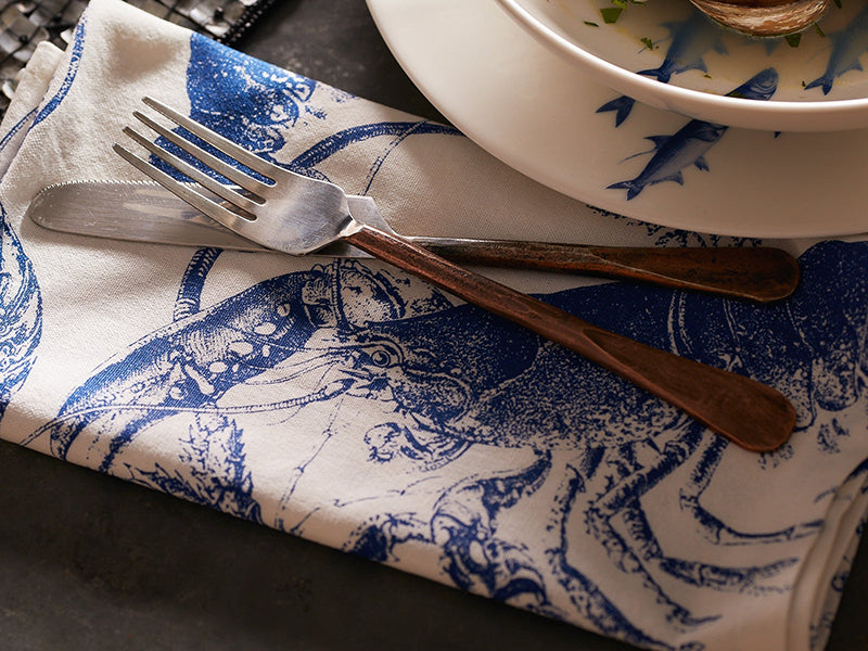 Close Up of Blue Lobster Dinner Napkin with Fork and Knife