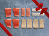 Wild Alaska Sockeye Salmon Portions, Wild Alaska Coho Salmon Portions, Wild Alaska Black Cod Portions, Wild Pacific Halibut Portions with Gift Bow Graphic on Top Right