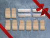 Wild Alaska Black Cod Portions and Wild Pacific Halibut Portions with Gift Bow Graphic on Top Right