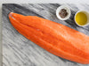 King Salmon Fillet on Marble Surface with Olive Oil and Seasoning