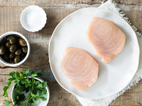 Swordfish Steaks on Plate with Capers, Salt, and Parsley