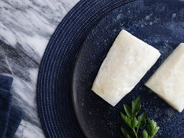 Wild Alaska Pacific Halibut Portions on Plate with Parsley