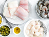 Sea Scallops, Wild Blue Shrimp, and Fish Portions on Plates