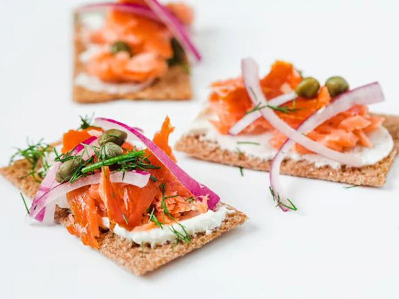 Hot Smoked Steelhead Trout Flaked on Cracker with Onion, Capers, and Dill