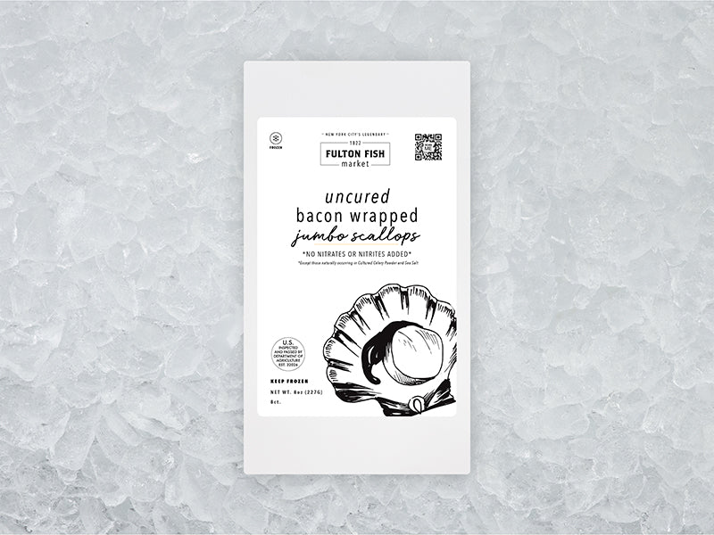 Front of Jumbo Bacon Wrapped Scallops package on ice