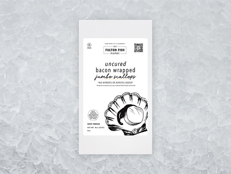 Front of Jumbo Bacon Wrapped Scallops package on ice