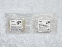 Fulton Fish Market Finishing Butter Bundle front of packages on ice