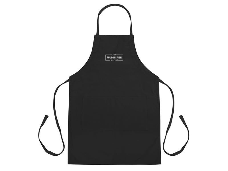 Black apron with a white embroidered Fulton Fish Market Logo