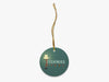 A Fishmas Story Blue Ornament with Gold String on White Background