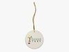 A Fishmas Story Beige Ornament with Gold String on White Background