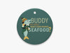 Close Up of Buddy the Smelt Blue Ornament on White Background