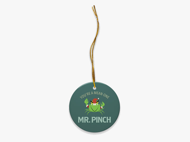 Mr. Pinch Blue Ornament with Gold String on White Background