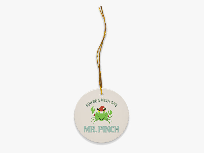 Mr. Pinch Beige Ornament with Gold String on White Background