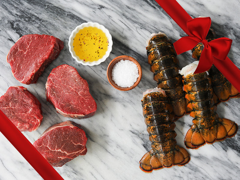 Fillet Mignon and Lobster Tails on Marble with Gift Ribbon