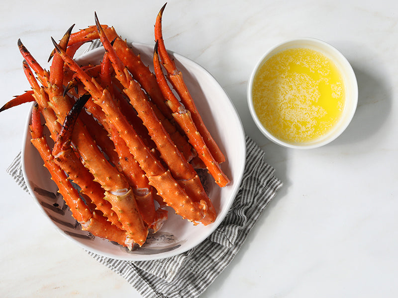 Golden King Crab Lower Legs in Bowl with Melted Butter